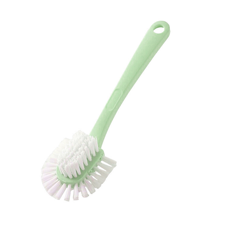 Ảnh cận cảnh bàn chải màu xanh lá với đầu chải rộng