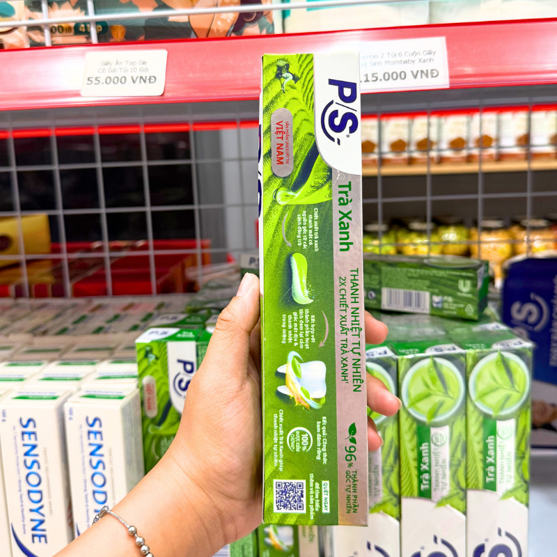 Mặt bên bao bì thể hiện tên dòng Trà Xanh và khối lượng 180g.