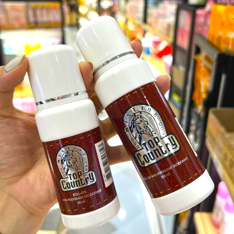Cận cảnh chai lăn nách Top Country màu đỏ và nắp trắng