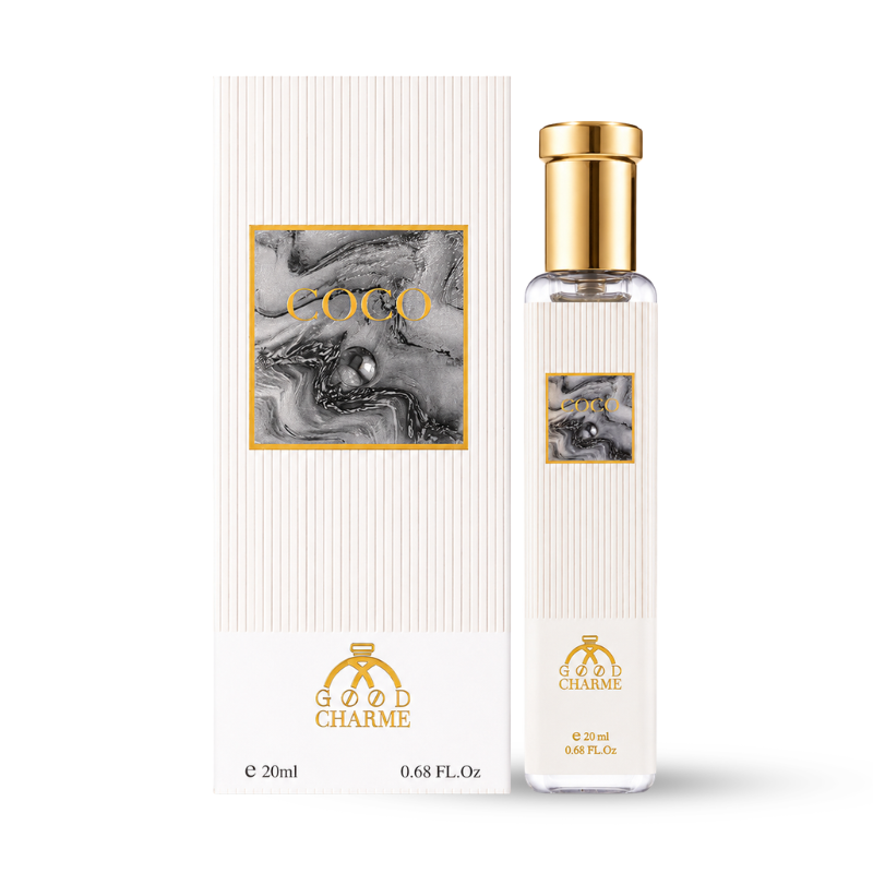 Chai thon 20ml đứng cạnh hộp trắng vân sọc, nắp vàng nổi bật.