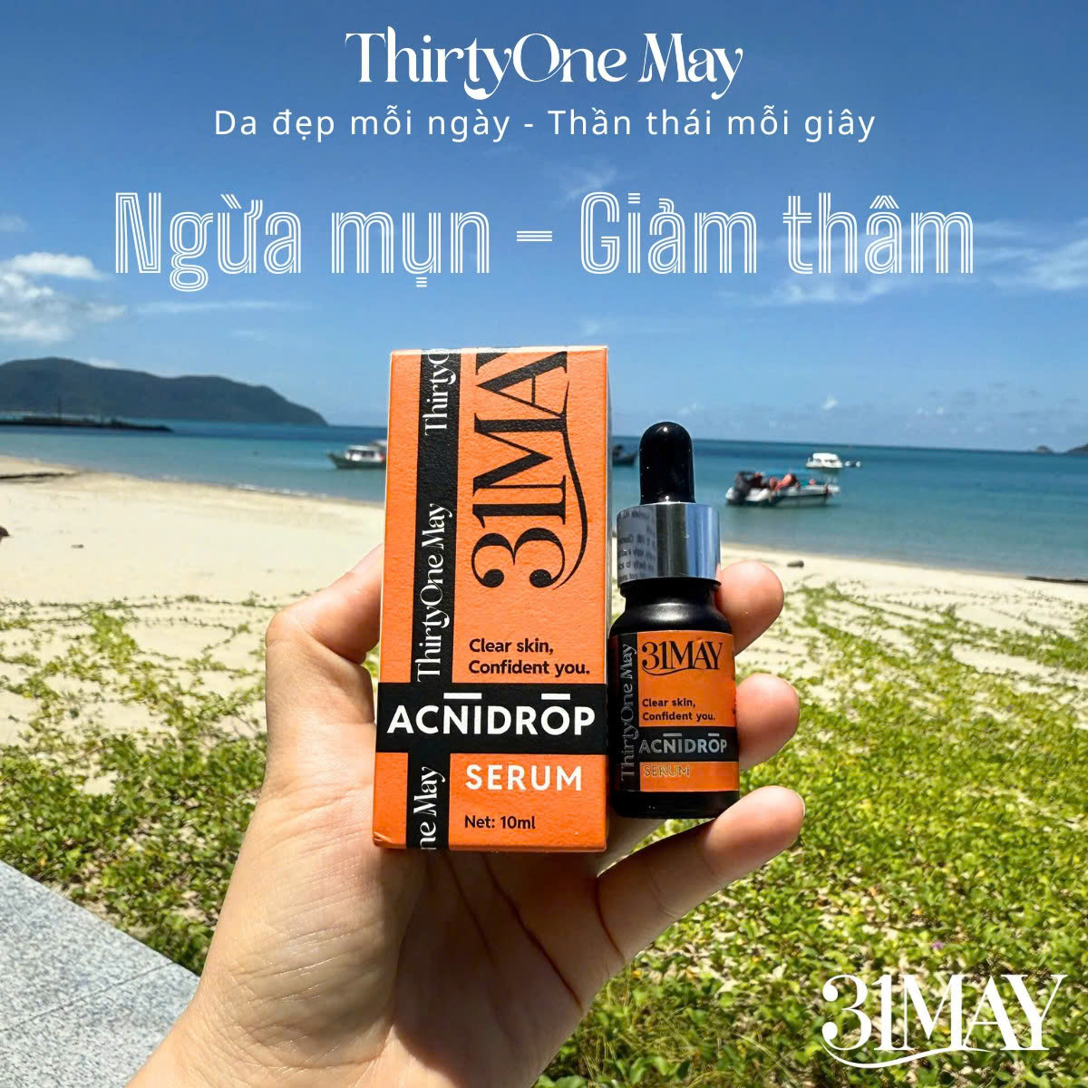 Chai nhỏ giọt 10ml và hộp cam đen được cầm trên tay ngoài trời