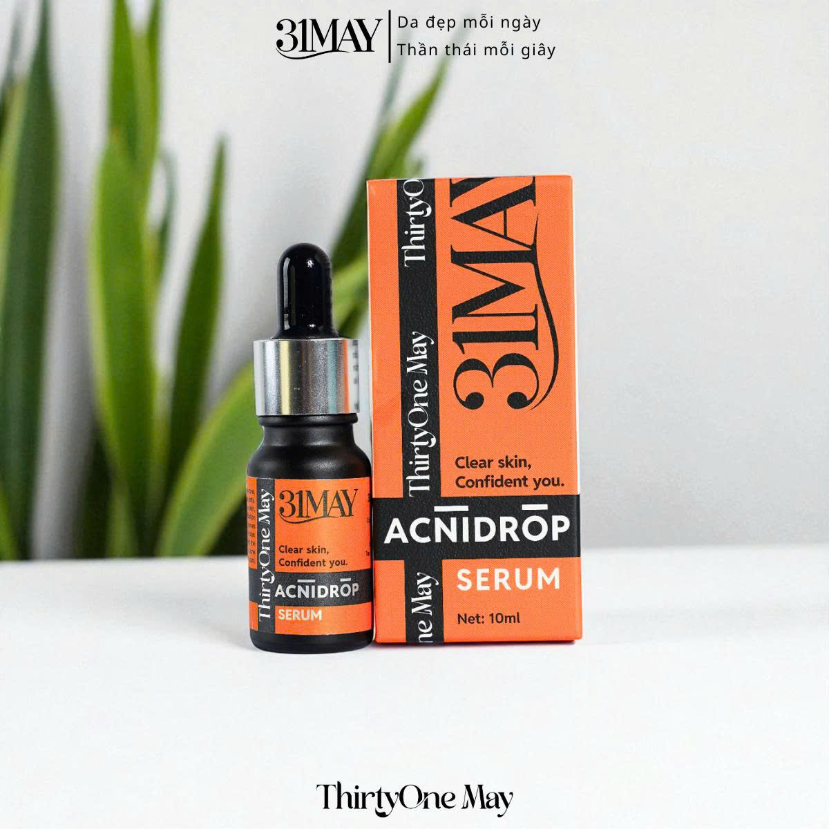 Chai nhỏ giọt và hộp cam đen ghi ACNIDROP SERUM 10ml