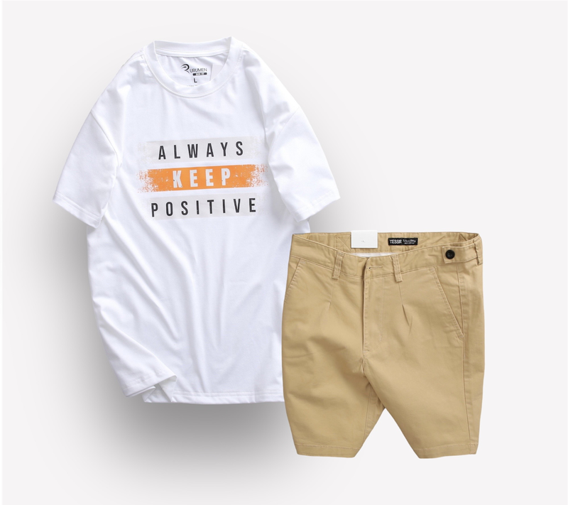 Phối áo trắng in chữ cùng quần short kaki màu be