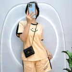 Đồ bộ quần đùi áo tay ngắn cổ tròn in hình mặt cười