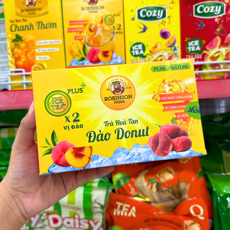 Mặt trước hộp với tên vị đào donut và hình minh họa quả đào