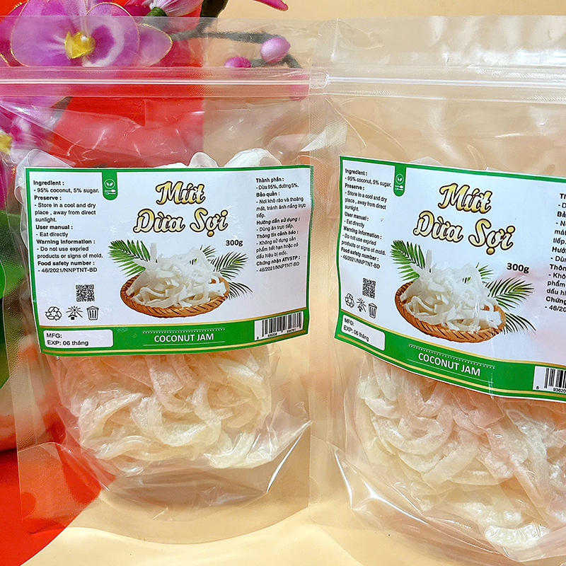 23383_z6129056898155-e66b94a20a4156ceddab8cd47df1dc22_20241214124302-1.jpg Mứt Dừa Sợi Túi Zip 300g - MDNMHCK