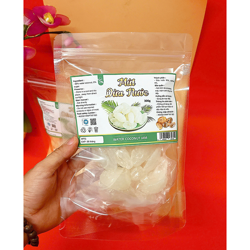 23385_z6125806478109-2a5baeaa44af32c0a8999e09fe071a6c_20241214111450-5.jpg Mứt Dừa Nước Túi Zip 300g - MDNHCK
