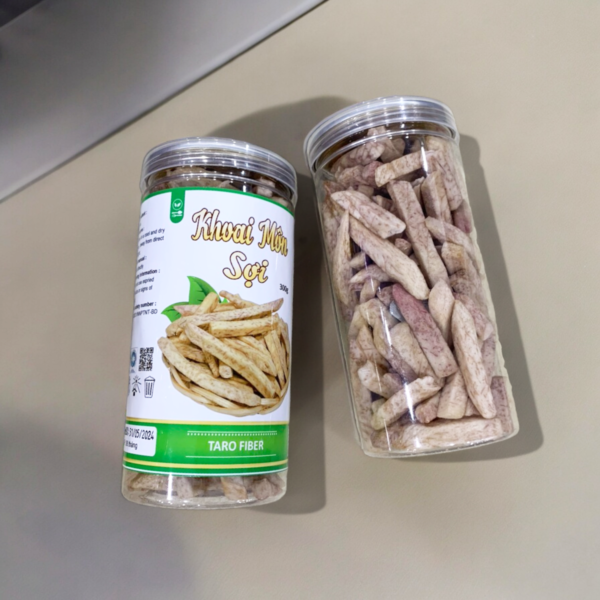 24446_z5494823637098-4b72a29f1ad790f6387e42ad263287c9-photoroom_20240601123645-3.png Khoai Môn Sấy Sợi Cộng Giòn 300g - 8936208930929